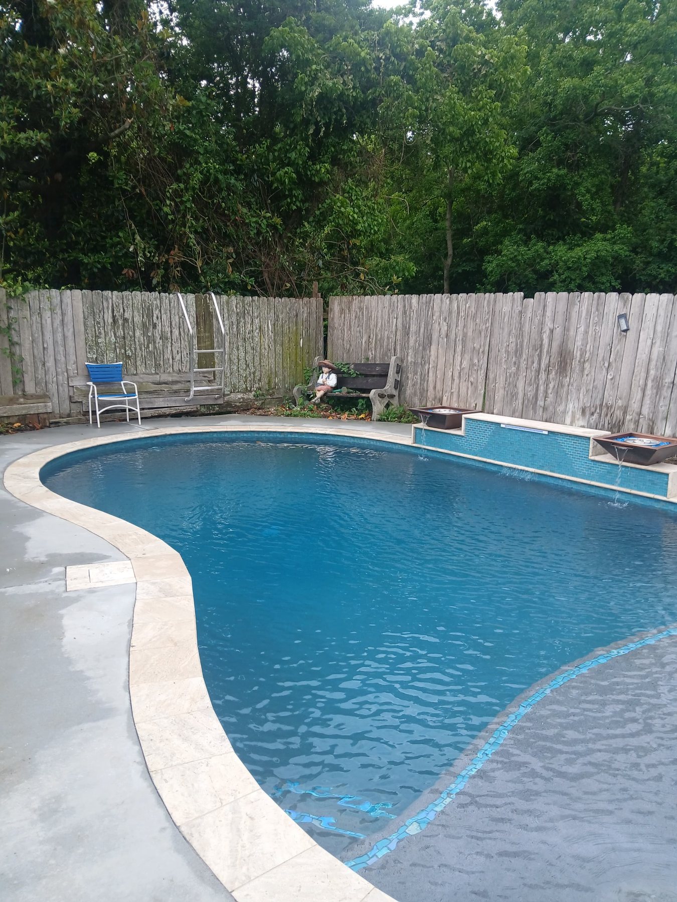 Westwego finished pool with fire bowls and water feature