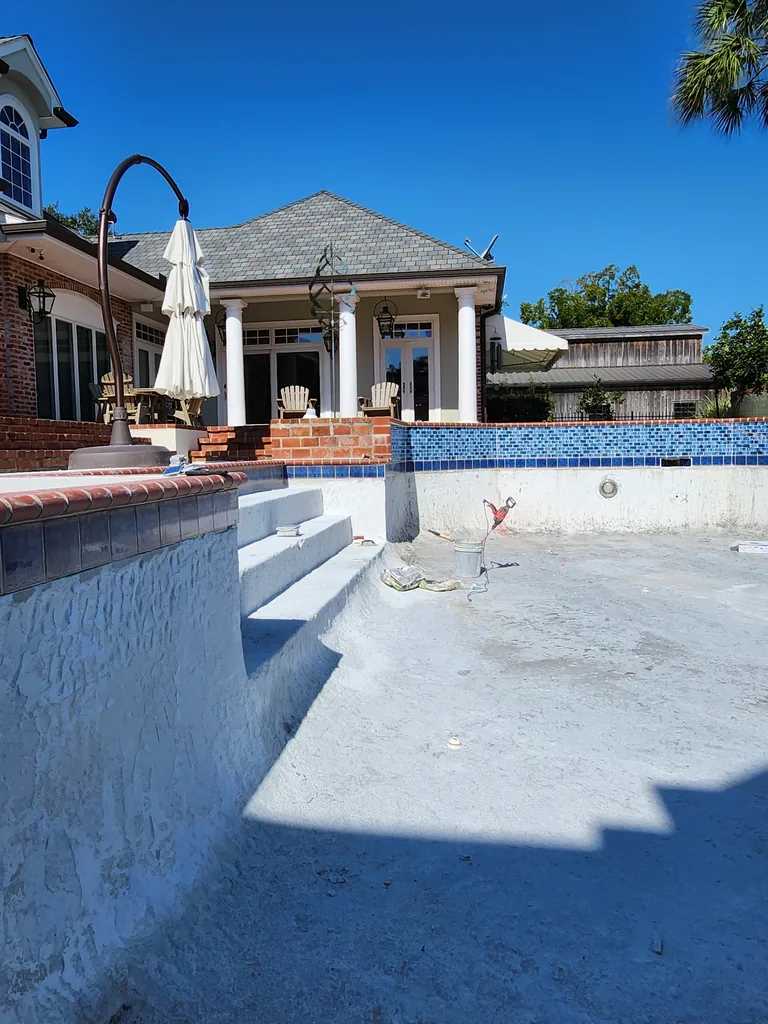 Pool steps and raised areas with exposed interior surfaces during renovation in Bourg, Louisiana